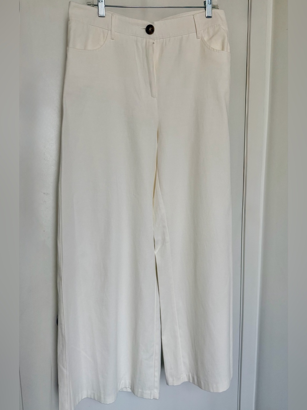 Zara ecru high-waisted wide-leg trouser.